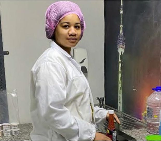 A production team member at her station